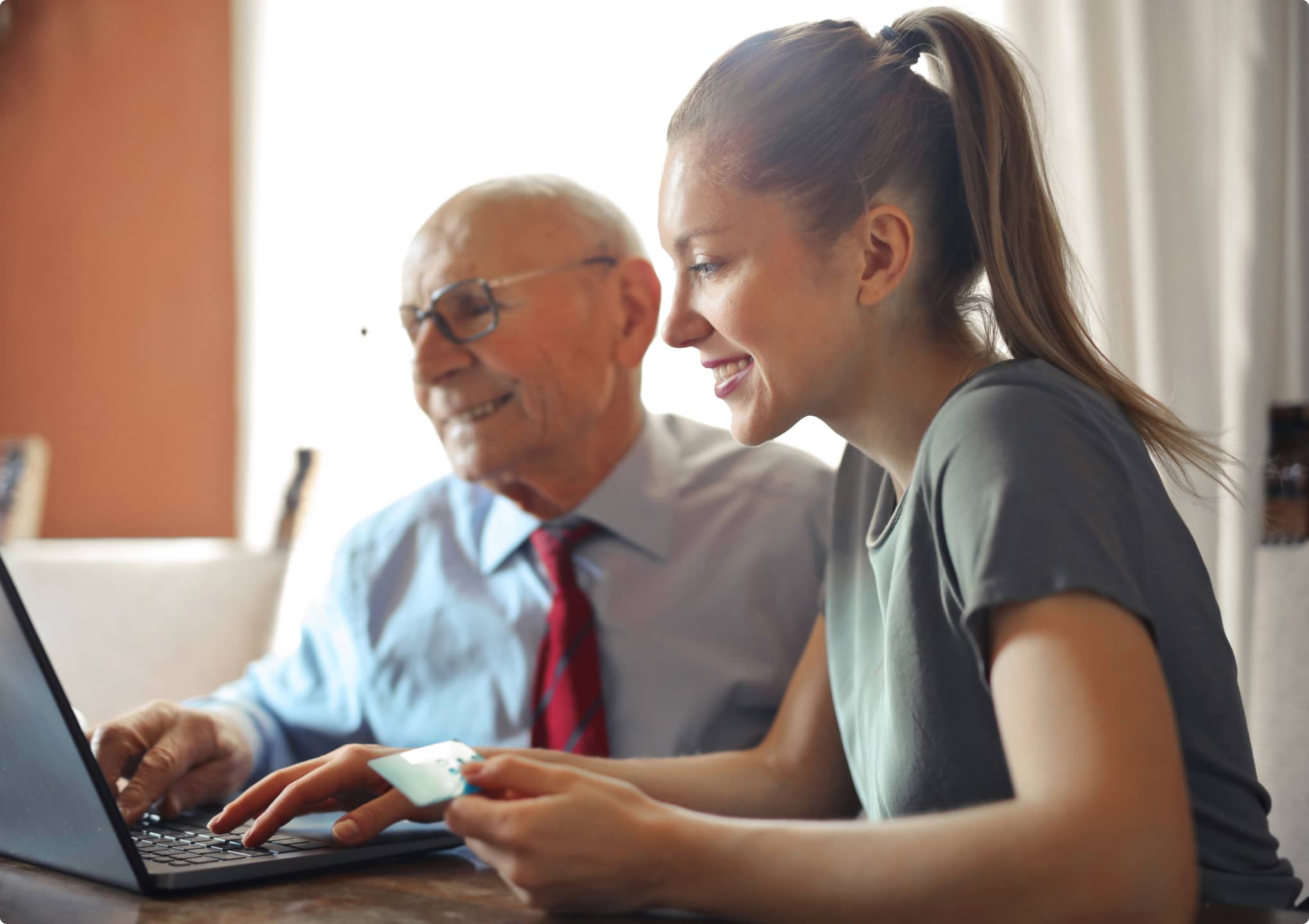 Post 2 -Making SMART Choices in the New Year Young woman and older man viewing laptop screen